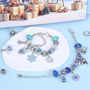 Close-up detail of blue DIY charm bracelet set featuring crystal beads and cute snowflake pendants.