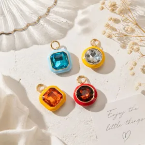 Detail shot of colorful geometric crystal pendants with drip oil finish, ideal for DIY jewelry.