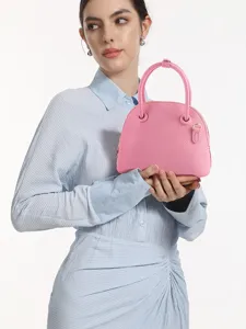 Chic pink dome handbag for women, stylish top handle bag with elegant design for daily wear.