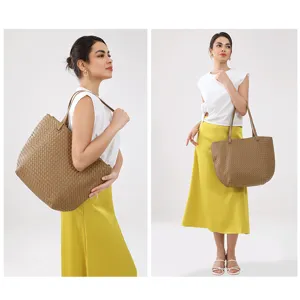 Detailed view of brown woven leather tote bag, showcasing premium intrecciato texture design.