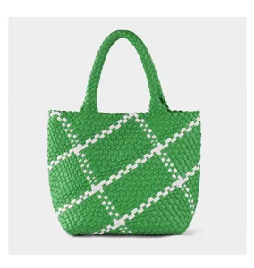 Green and white woven detail of the large capacity tote handbag, stylish diagonal pattern.