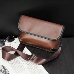 Brown PU leather crossbody messenger bag detail shot, featuring adjustable strap and flap closure.