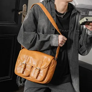 Trendy retro PU leather messenger bag for men, casual crossbody bag with vintage double buckle design.