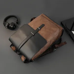 Retro PU leather men's backpack in brown and black color block with metal buckle detail.