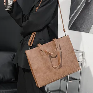 PU leather casual tote bag detail showing texture, stylish brown horizontal crossbody handbag.
