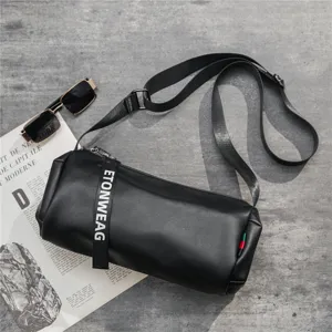 Stylish black cylindrical crossbody bag for men and women, casual PU leather shoulder bag.