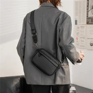 Men black PU leather crossbody bag detail, stylish casual chest bag with wide strap.
