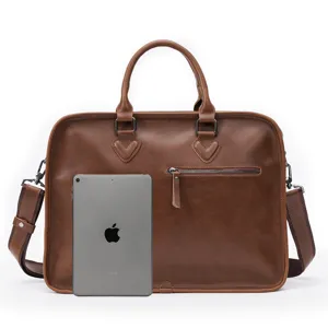 Retro brown leather business briefcase with shoulder strap, ideal for laptop and office.