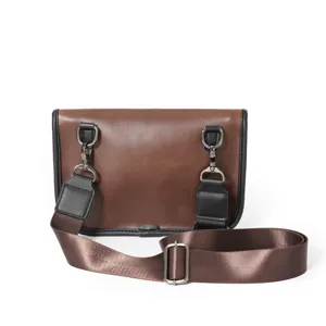 Brown PU leather messenger bag detail showing adjustable strap and metal hardware.