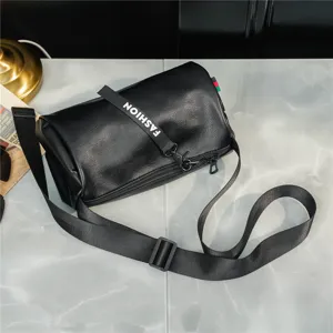 Black leather cylinder crossbody bag, stylish casual shoulder bag for men and women.