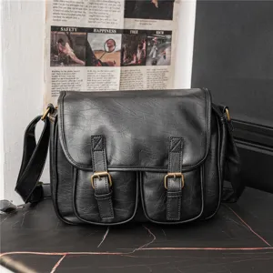 Black vintage PU leather messenger bag with dual front pockets and retro metal buckles.