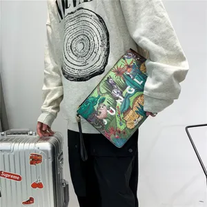 Detail view of men's casual printed clutch bag with jungle animal design and convenient wrist strap.