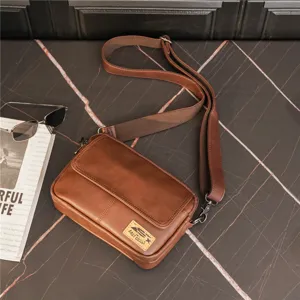 Brown PU leather retro messenger bag detail, showing adjustable strap and front flap design.