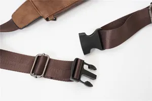 Chest bag strap and buckle detail close-up, showing durable nylon webbing and metal hardware.