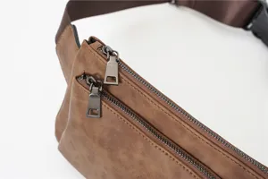 Brown matte leather chest bag detail, multi-zipper pocket design, stylish streetwear style.