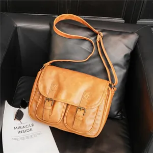Brown vintage leather shoulder bag detail, stylish crossbody bag for daily casual wear.