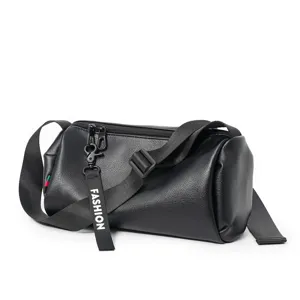 Black leather cylindrical cross-body bag with stylish strap, casual barrel bag for daily use.