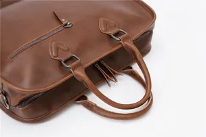 Brown leather retro briefcase detail view, professional men's business laptop handbag.