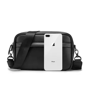 Black PU leather single shoulder cross-body small chest bag, detailed view showing texture and hardware.