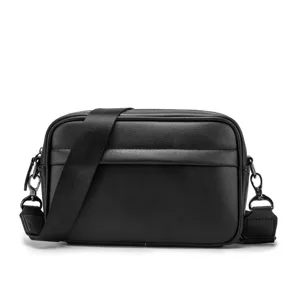 Black PU leather crossbody shoulder bag detail featuring textured surface and durable hardware.
