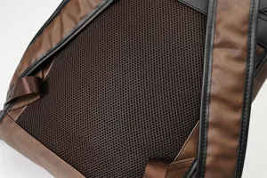 Detail shot of men retro PU leather backpack back panel with breathable mesh and sturdy straps.