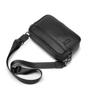 Men black pu leather crossbody sling bag detail shot, compact shoulder messenger bag style.