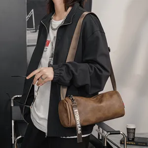 Borsa a tracolla cilindrica alla moda, piccola borsa casual in pelle per uso quotidiano.