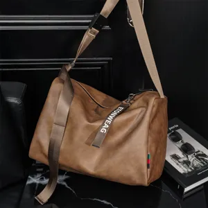 Detailed view of large capacity brown leather shoulder messenger bag with strap and dark scene.