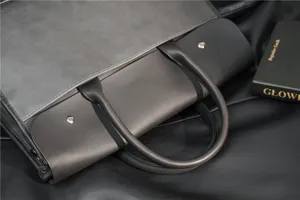 Men's leather business briefcase detail shot, large capacity stylish laptop handbag.