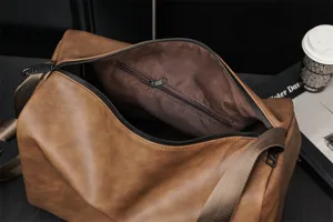 Large capacity brown travel duffel bag for men, casual shoulder messenger bag for daily use.