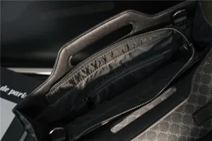 Men's business casual briefcase handbag interior detail showing zipper pocket and structured handles.
