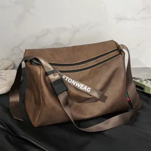 Brown large capacity messenger bag detail view with adjustable strap and buckle.