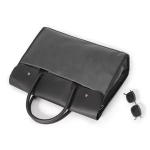 Detailed view of the large capacity grey and black men business briefcase leather handle.