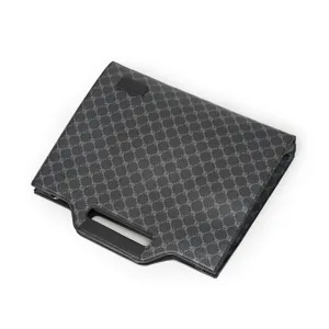 Close-up detail of luxury style monogram men business document briefcase bag with handle.