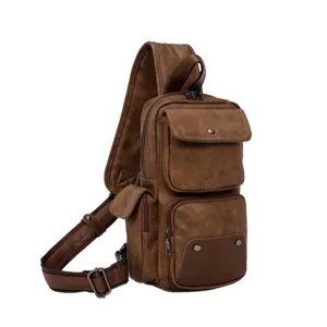 Close-up detail of the brown leather men sling bag, showing multiple pockets and metal zippers.