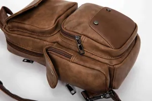 Men vintage PU leather chest bag detail, multi-pocket casual sling backpack for daily use.