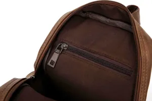 Detailed view of men brown leather chest bag interior with secure zipper pocket and lining.