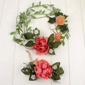Detailed view of bohemian artificial peony flower crown and matching decorative floral set.