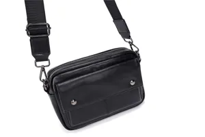 Men's black leather crossbody bag with adjustable wide strap and front pockets for daily use.
