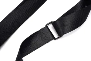 Detailed view of the black adjustable shoulder strap and metal buckle for crossbody bag.