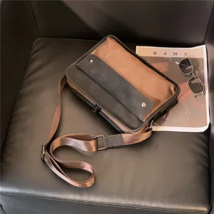 Retro canvas messenger bag for men, stylish spliced shoulder crossbody bag, casual daily use.