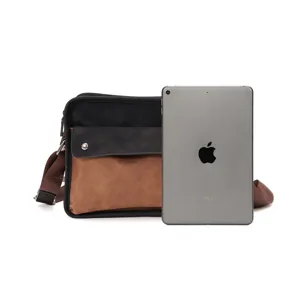 Detailed view of the vintage color-block messenger bag shown with an iPad for size reference.