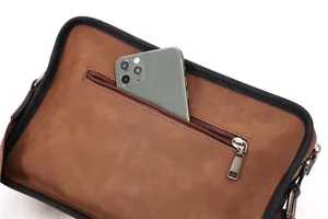 Detail view of vintage men messenger bag showing zipper pocket and phone storage capacity.