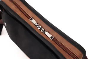 Close-up detail shot of a stylish men casual vintage messenger crossbody shoulder bag.