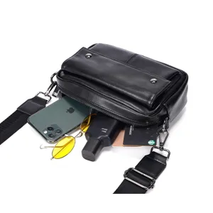 Stylish black leather men crossbody bag featuring front pocket and adjustable strap.