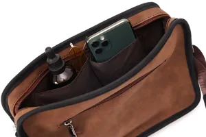 Detailed view of vintage brown men messenger bag interior showing spacious storage pockets.