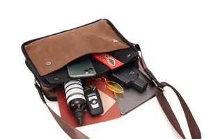 Vintage brown messenger bag for men, stylish crossbody shoulder bag with spacious interior capacity.
