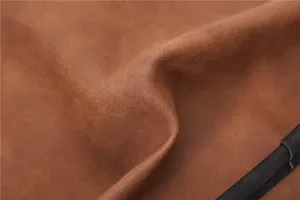 Brown leather messenger bag detail texture, vintage casual men's crossbody bag close up view