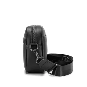 Detail view of black PU leather men crossbody chest bag, showing zipper and thick strap.