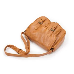 Detailed view of retro brown PU leather shoulder bag with double pockets and adjustable strap.